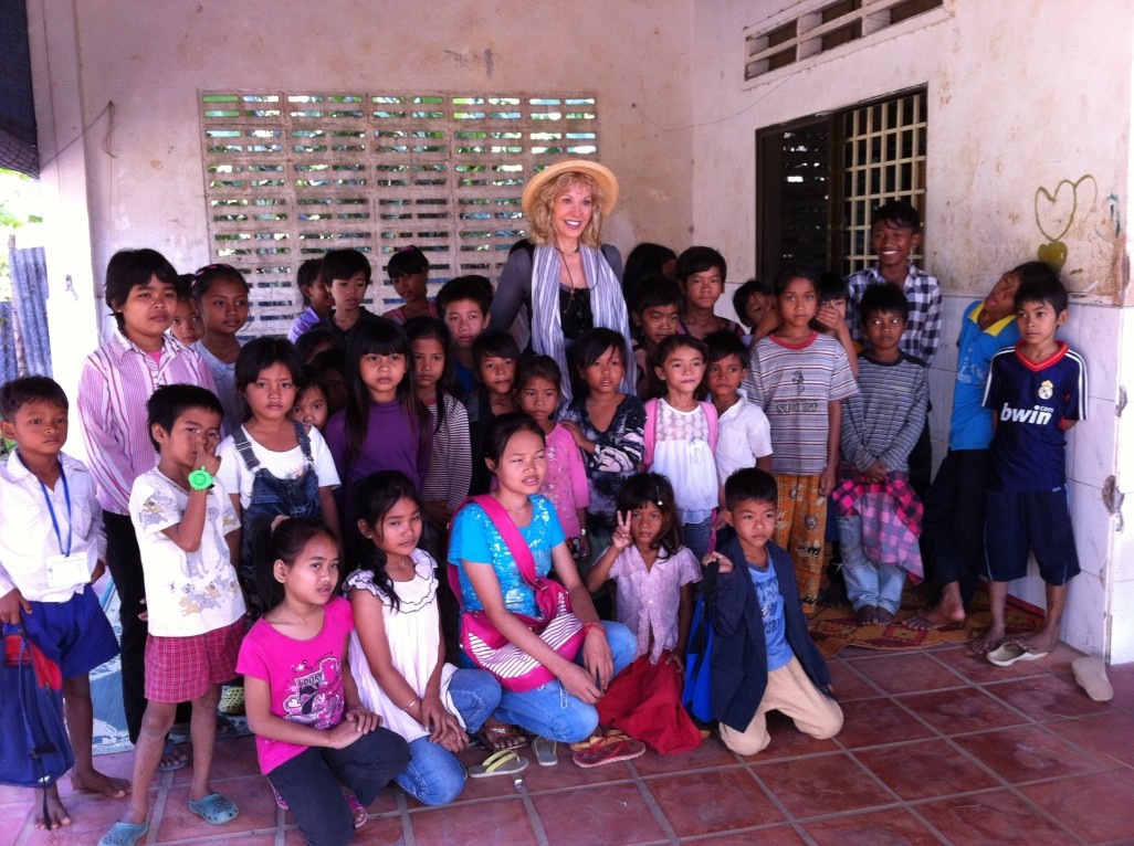 Marlise Karlin smiling with diverse group of children